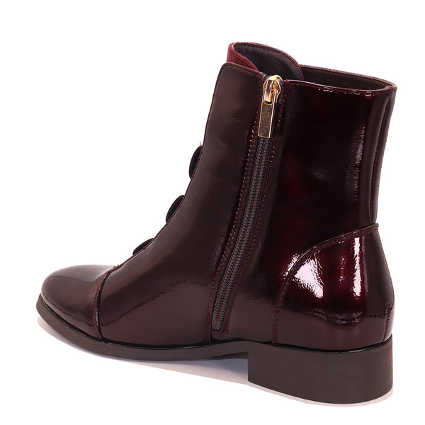 Bottine vernie à brides élastiques et détail doré