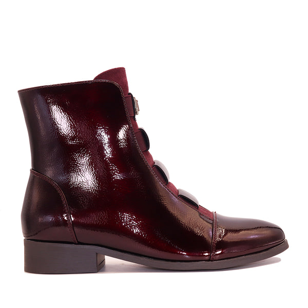 Bottine vernie à brides élastiques et détail doré